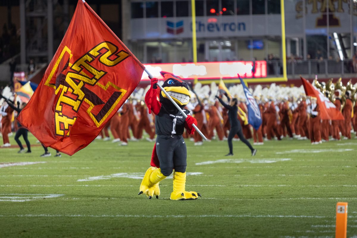 Cy waves the Iowa State flag during the marching bands opening performance during the Iowa State Cyclones and Cincinnati Bearcats game in Ames Iowa on Nov. 16, 2024.