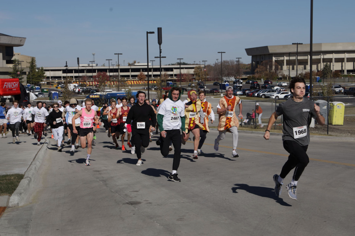 Runners take off from the starting line. More than 2,000 runners participated in Iowa State's Homecoming 5K on Sunday, Oct. 27, 2024. The money from entry fees was donated to Lutheran Services in Iowa, a local non-profit that provides services to children and families in Ames.