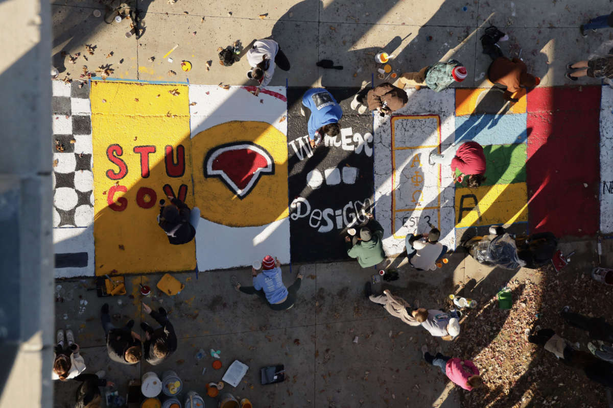 Members of more than 20 student organizations painted squares on "Victory Lane" on Sunday, Oct. 27, 2024. Gabrielle Townsend, a member of the Student Alumni Leadership Council, said, "It's a really fun tradition we've had for a long time." Victory Lane was moved closer to Jack Trice Stadium this year, in hopes of making it more accessible to fans attending the Homecoming game.