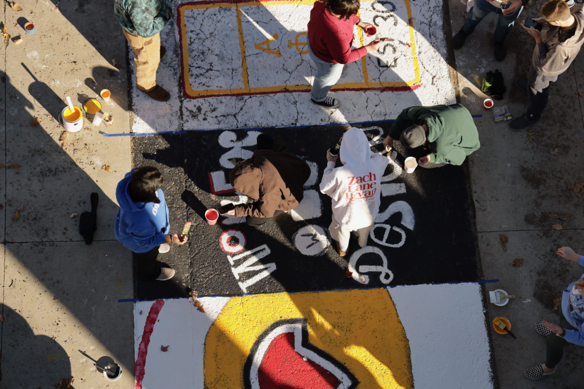 Members of more than 20 student organizations painted squares on "Victory Lane" on Sunday, Oct. 27, 2024. Gabrielle Townsend, a member of the Student Alumni Leadership Council, said, "It's a really fun tradition we've had for a long time." Victory Lane was moved closer to Jack Trice Stadium this year, in hopes of making it more accessible to fans attending the Homecoming game.