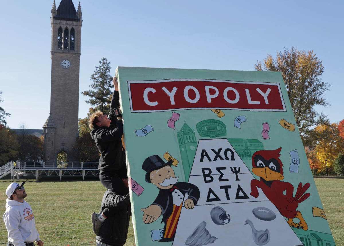 Delta Tau Delta members secure support beams for their banner on Central Campus, Oct. 16, 2024. Their team is one of 15 competing in Iowa State's banner display competition, part of the university's homecoming celebrations from Oct. 27 to Nov. 2, 2024.