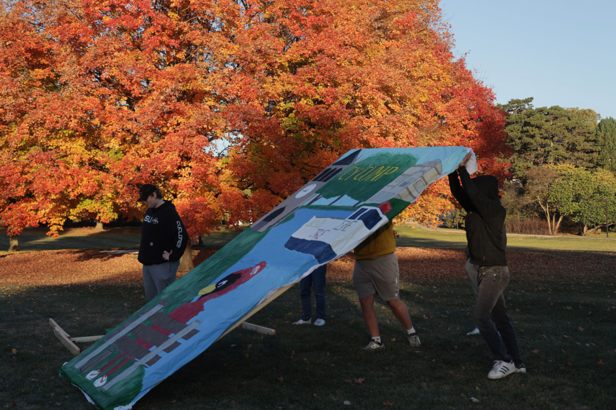 Members of Iowa State Greek Life set up their banner displays on Central Campus on Saturday, Oct. 26, 2024. Fifteen teams are competing in the display competition, part of the university’s homecoming celebrations from Oct. 27 to Nov. 2, 2024.