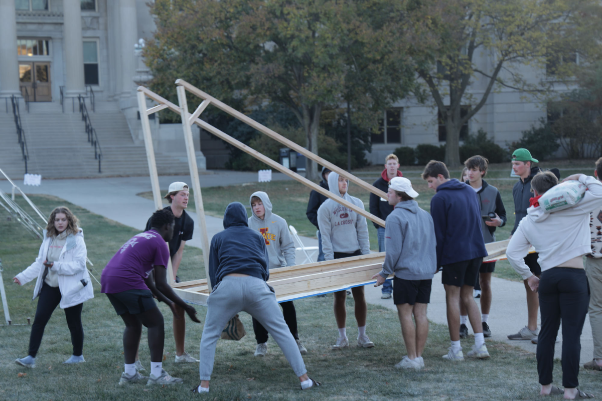 Members of Iowa State Greek Life set up their banner displays on Central Campus on Saturday, Oct. 26, 2024. Fifteen teams are competing in the display competition, part of the university’s homecoming celebrations from Oct. 27 to Nov. 2, 2024.