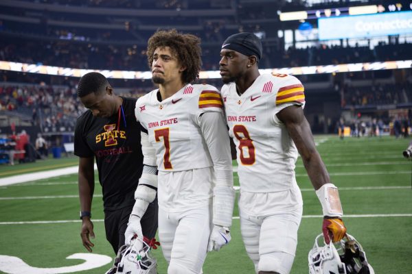 Defensive Back Malik Verdon (7) and Wide Receiver Isaiah Alston (8) get emotional after Iowa State's loss to Arizona State University in the Big 12 Championship football game at AT&T Stadium in Arlington, Texas on Dec. 7, 2024. 