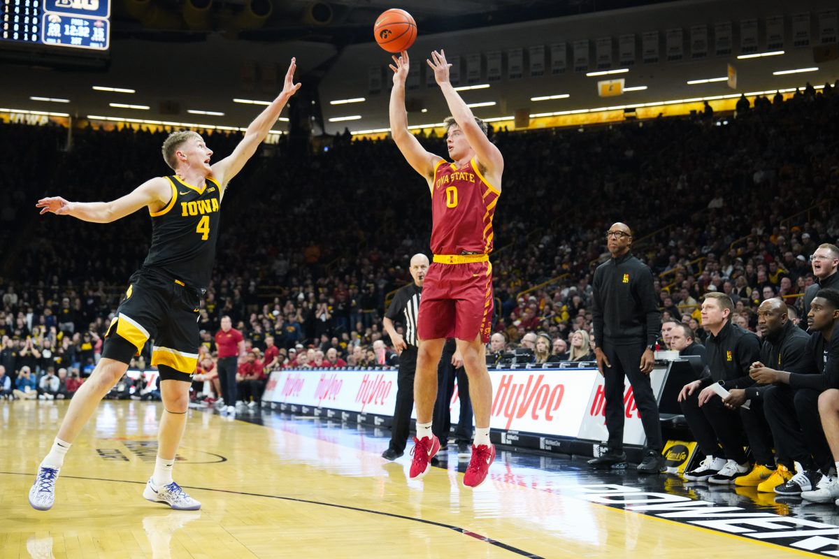 Nate Heise shoots for three during the 2024 Cy-Hawk matchup, Carver-Hawkeye Arena, Iowa City, Iowa, Dec. 12, 2024.