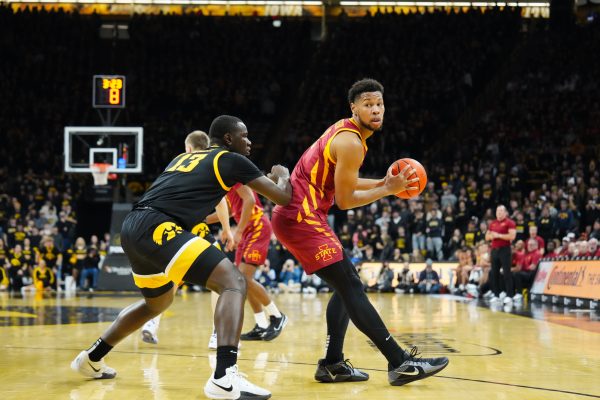 Joshua Jefferson looks for an opening during the 2024 Cy-Hawk matchup, Carver-Hawkeye Arena, Iowa City, Iowa, Dec. 12, 2024.