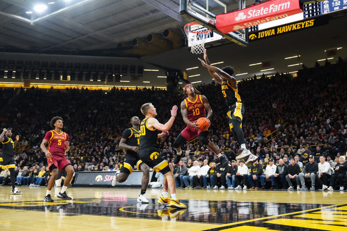 Keshon Gilbert (10) goes for the layup during the 2024 Cy-Hawk matchup, Carver-Hawkeye Arena, Iowa City, Iowa, Dec. 12, 2024.