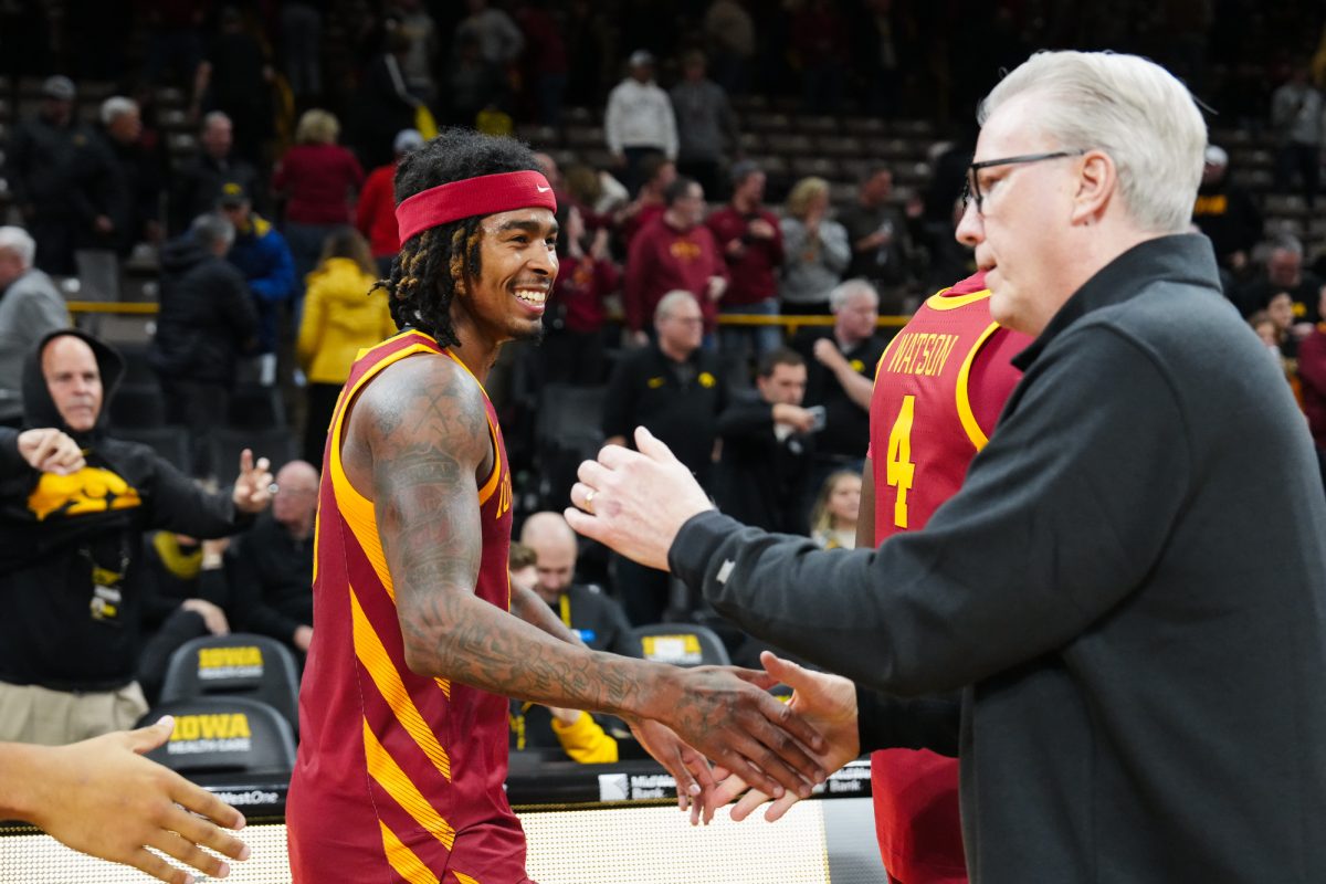 Senior guard Keshon Gilbert (10) shakes hands with Iowa men's basketball head coach Fran McCaffery after the 2024 Cy-Hawk matchup, Carver-Hawkeye Arena, Iowa City, Iowa, Dec. 12, 2024.