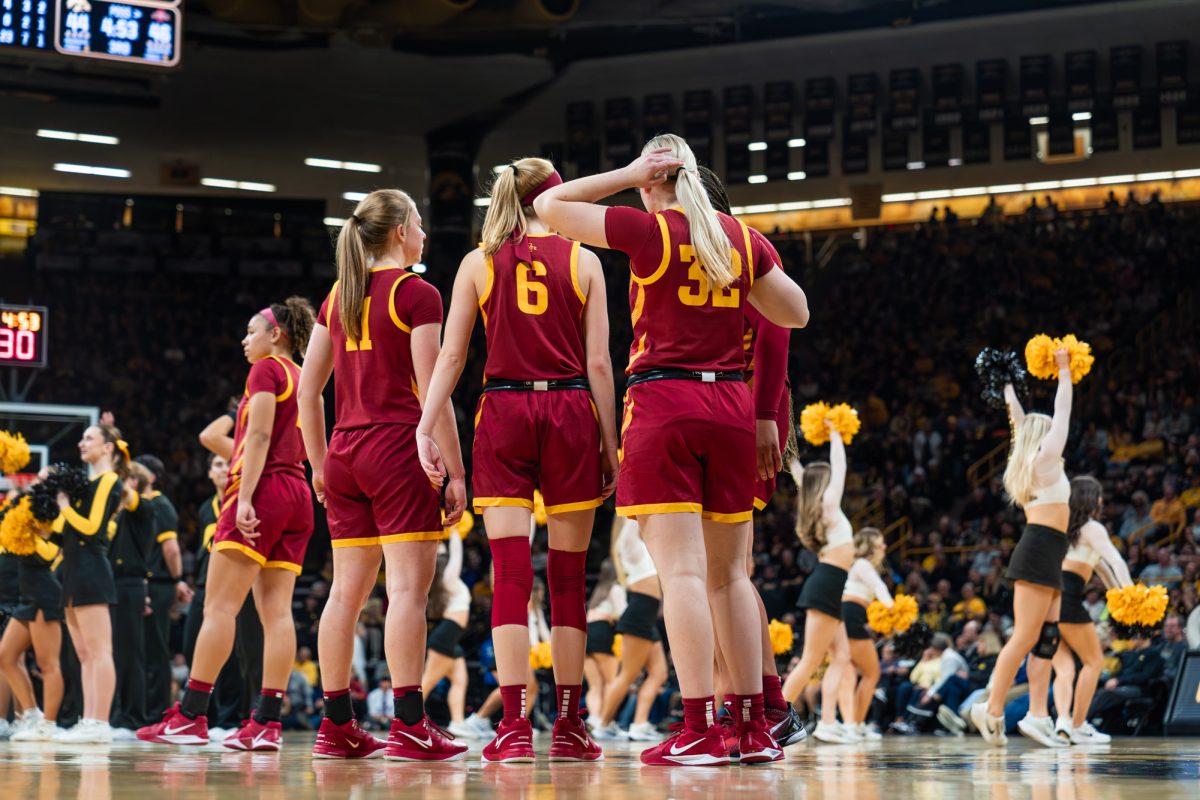 The Iowa State women's basketball team waits for the game to resume after a timeout, Carver-Hawkeye Arena, Dec. 11, 2024. The Hawkeyes beat the Cyclones 75-69 in the 50th Cy-Hawk matchup. 