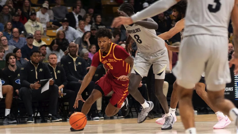 Curtis Jones (#5) drives through Colorado defenders during the Iowa State vs. Colorado basketball game, CU Events Center, Boulder, Colorado, Dec. 30, 2024.