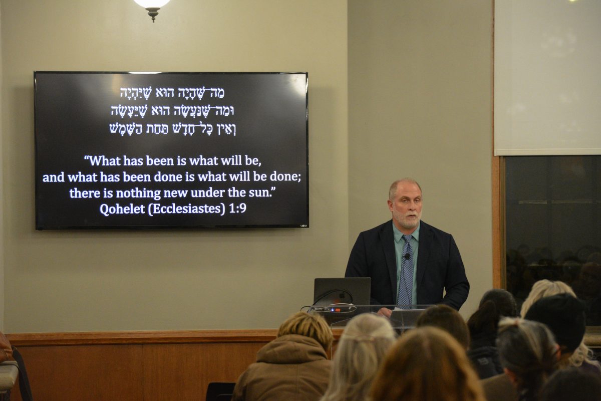 Robert Cargill discusses the role religion plays in world conflicts during his lecture “Ancient Origins of Religious Conflict” at the Memorial Union, Ames, Iowa, Dec. 4, 2024.