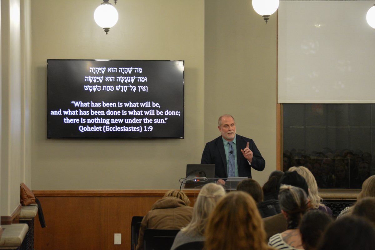 Robert Cargill discusses the role religion plays in world conflicts during his lecture “Ancient Origins of Religious Conflict” at the Memorial Union, Ames, Iowa, Dec. 4, 2024.