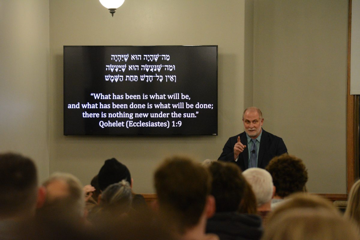 Robert Cargill discusses the role religion plays in world conflicts during his lecture “Ancient Origins of Religious Conflict” at the Memorial Union, Ames, Iowa, Dec. 4, 2024.