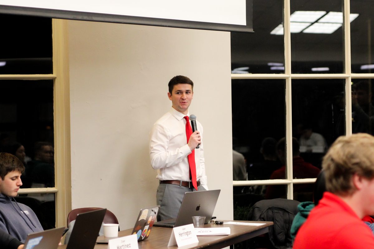 Student Government President Martin Harsh talks to the Senate during their meeting about upcoming events and the end of the semester at the Memorial Union, on Dec. 4, 2024.