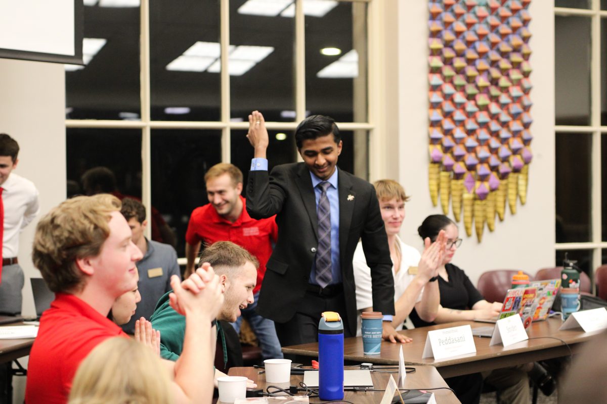 Senator Hemanthsai Peddasani cheering on the cyclones to conclude the semester during student government at the Memorial Union, on Dec. 4, 2024.