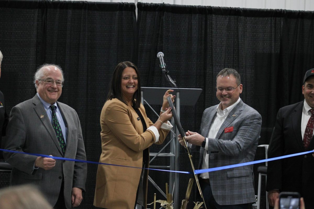 Mayuri Farlinger (left) and Dr. Matt Darr (right) cut the ribbon at the ribbon ceremony of the new Alliant Energy Agriculture Innovation Lab, Dec. 5, 2024.