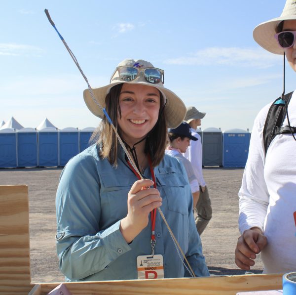 Sydney Turner, Cyclone Rocketry's first female president, poses for a photo at the 2023 Spaceport America Cup.