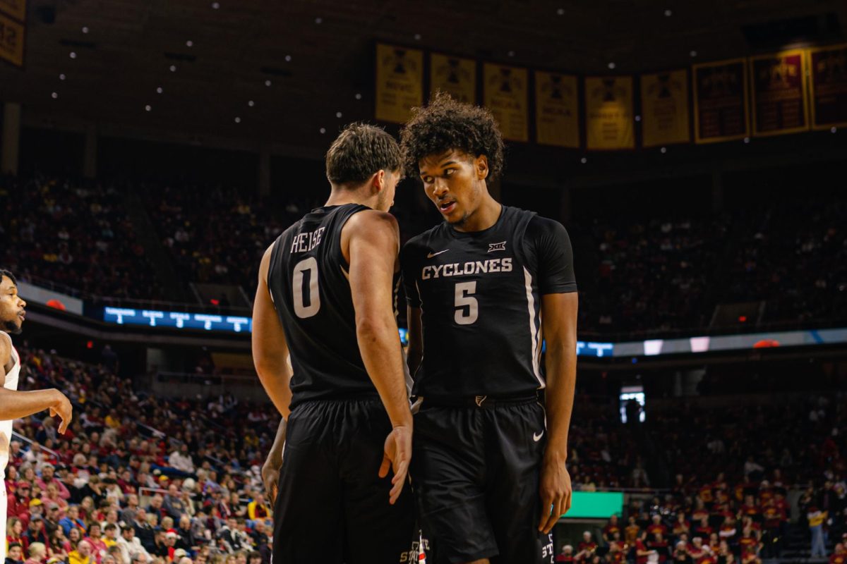 Curtis Jones (5) and Nate Heise (0) during the Morgan State University NCAA men's basketball game at Hilton Coliseum on Sunday, Dec. 22, 2024, in Ames, Iowa.