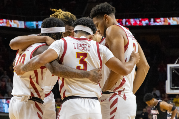 Keshon Gilbert (10), Tamin Lipsey (3), and Joshua Jefferson (2) huddle with teammates before tip off against the University of Nebraska Omaha, Hilton Coliseum, Dec. 15, 2024. 