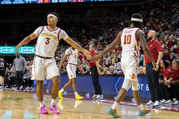 Tamin Lipsey (3) and Keshon Gilbert (10) exchange a high five during a game against the University of Nebraska Omaha, Hilton Coliseum, Dec. 15, 2024.