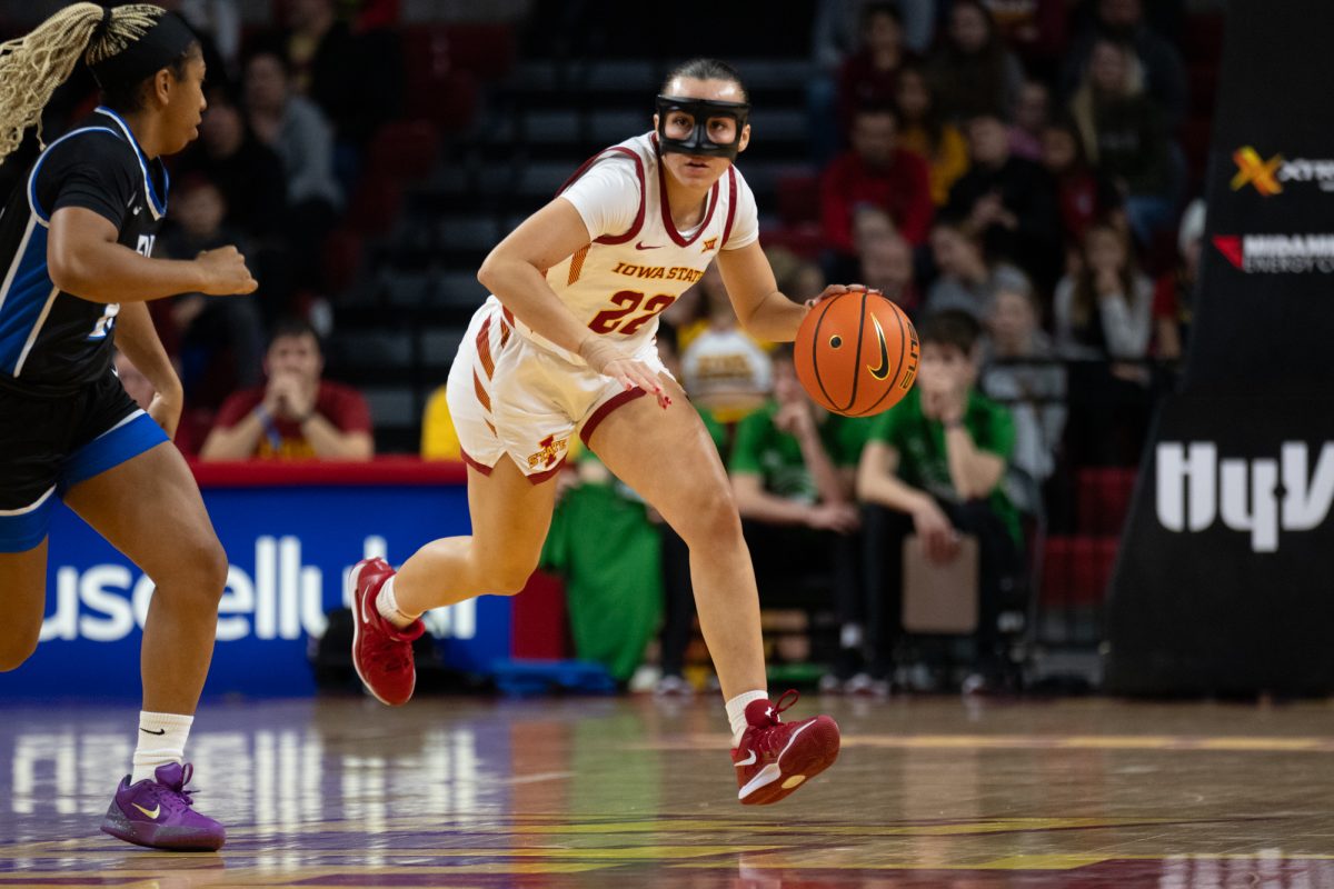 Reagan Wilson (22) dribbles the ball down the court during the game vs. Eastern Illinois,Hilton Coliseum, Ames, Iowa, Dec. 15, 2024.