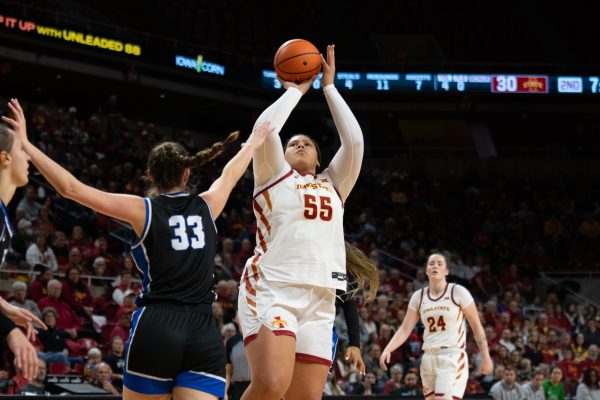 Audi Crooks (55) shoots the ball while being guarded by Macy McGlone (33) during the game vs. Eastern Illinois,Hilton Coliseum, Ames, Iowa, Dec. 15, 2024.