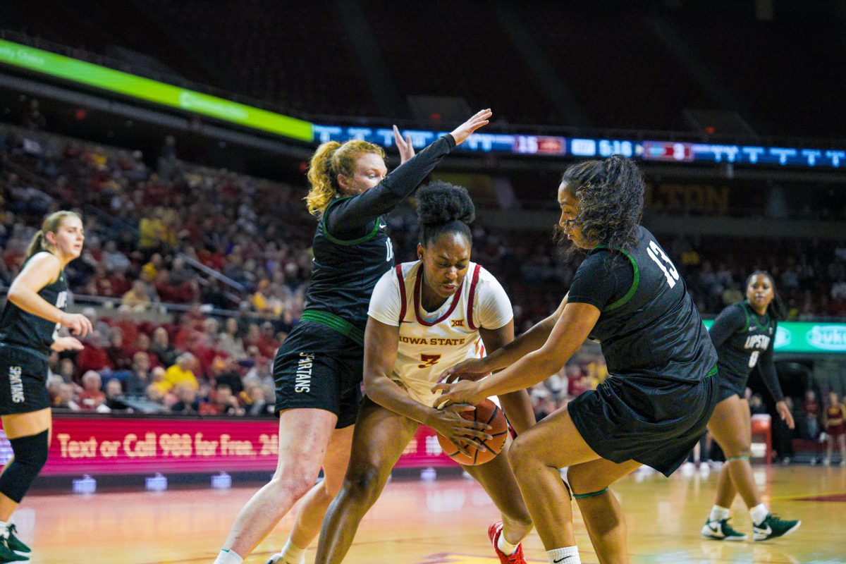 Alisa Williams (3) for Iowa State fights her way out of being double teamed by two Upstate players while she has the ball at Hilton Coliseum, Dec. 3, 2024.