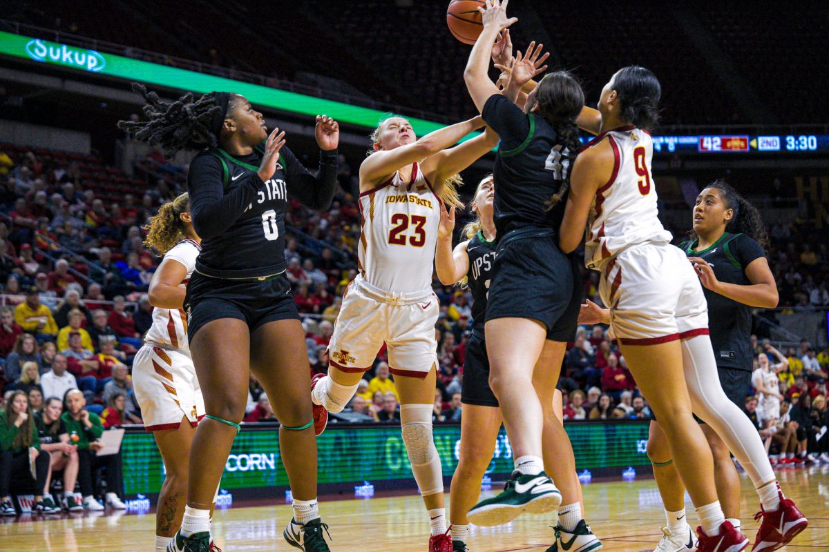 Iowa State Kelsey Joens (23) and Lilly Taulelei (9) both add a rebound to their game stats  with three Upstate players, all trying to get the ball back for their team, Hilton Coliseum, Dec. 3, 2024.