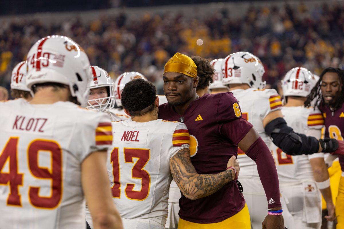 Jaylin Noel (13) congratulates Jeff Sims (6) after the Arizona State Sun Devils win the championship game at AT&T Stadium in Arlington Texas on December 7th, 2024.  