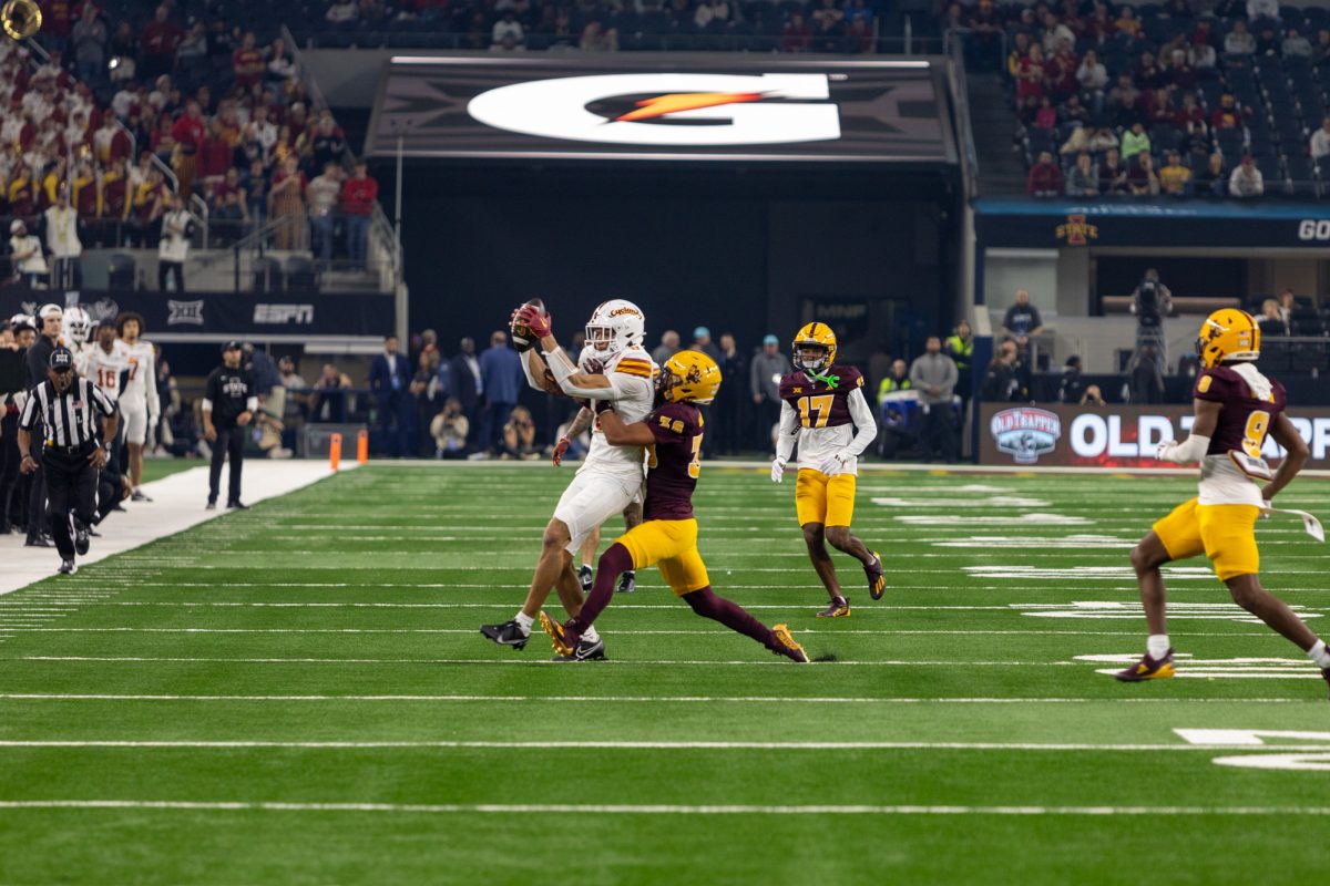 Jayden Higgins (9) makes a successful catch against Kyan McDonald (38) during the 3rd quarter of the championship game against the Arizona State Sun Devils at AT&T Stadium in Arlington Texas on December 7th, 2024.  