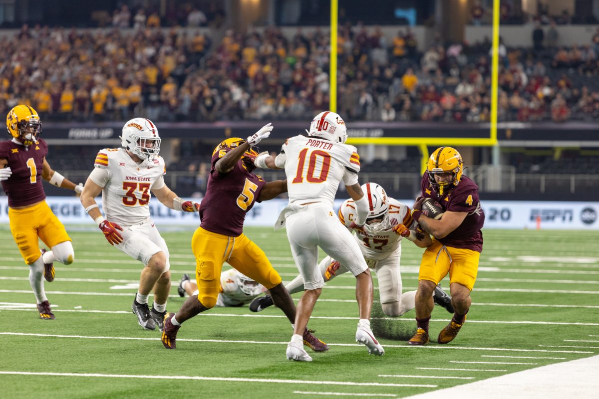 Darien Porter (10) and Beau Freyer (17) go for the tackle against Cam Skattebo (4) of the Arizona State Sun Devils during the championship game against at AT&T Stadium in Arlington Texas on December 7th, 2024.  