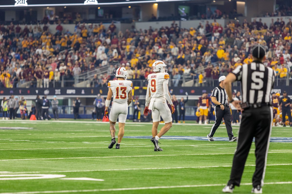 Jaylin Noel (13) and Jayden Higgins (9) walk back to formation after a play during the championship game against the Arizona State Sun Devils at AT&T Stadium in Arlington Texas on December 7th, 2024.  