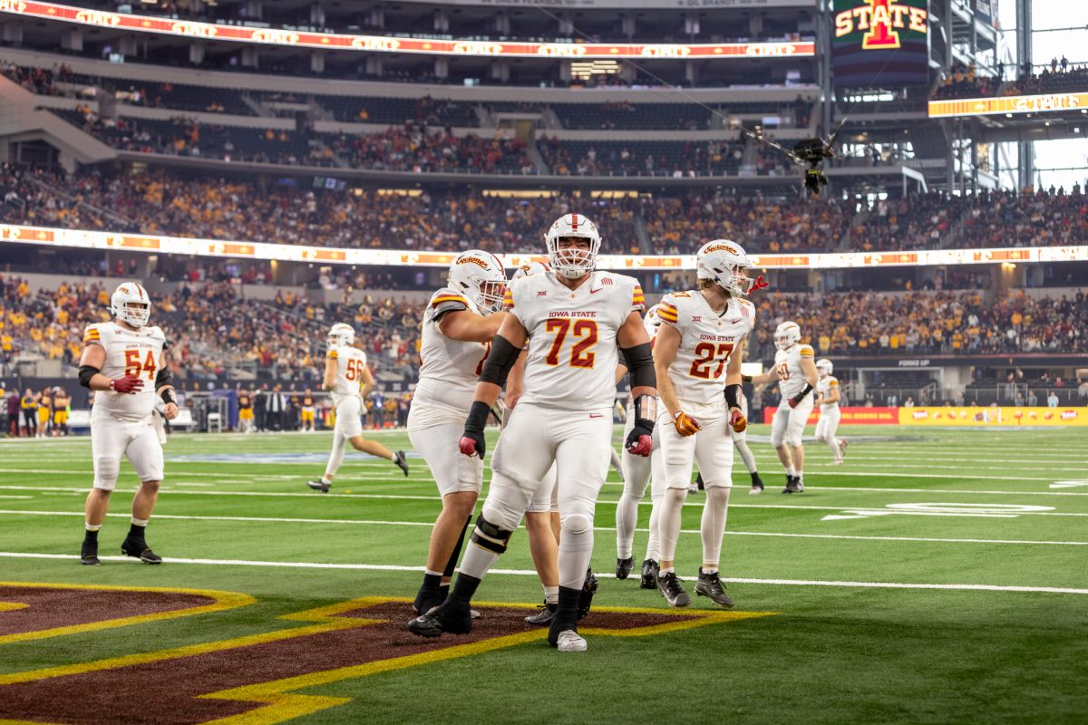 Jalen Travis (72) celebrates the touchdown scored by Carson Hansen (26) early in the first quarter of the championship game against the Arizona State Sun Devils at AT&T Stadium in Arlington Texas on December 7th, 2024.