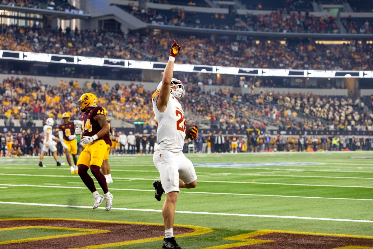 Carson Hansen (26) celebrates after scoring a touchdown early in the first quarter of the championship game against the Arizona State Sun Devils at AT&T Stadium in Arlington Texas on December 7th, 2024.