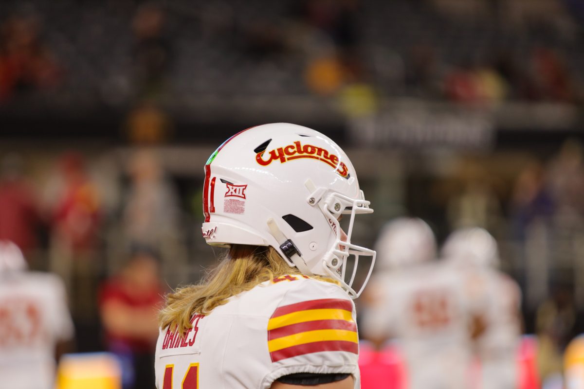 Iowa State players rock the red and yellow script style helmets for the championship game against the Arizona State Sun Devils at AT&T Stadium in Arlington Texas on December 7th, 2024.