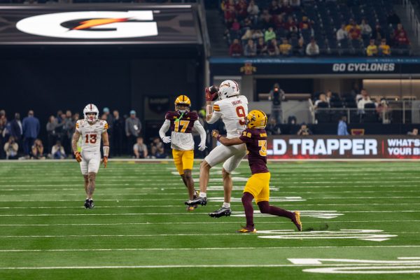 Jayden Higgins (9) makes a successful catch against Kyan McDonald (38) during the 3rd quarter of the championship game against the Arizona State Sun Devils at AT&T Stadium in Arlington Texas on December 7th, 2024.  