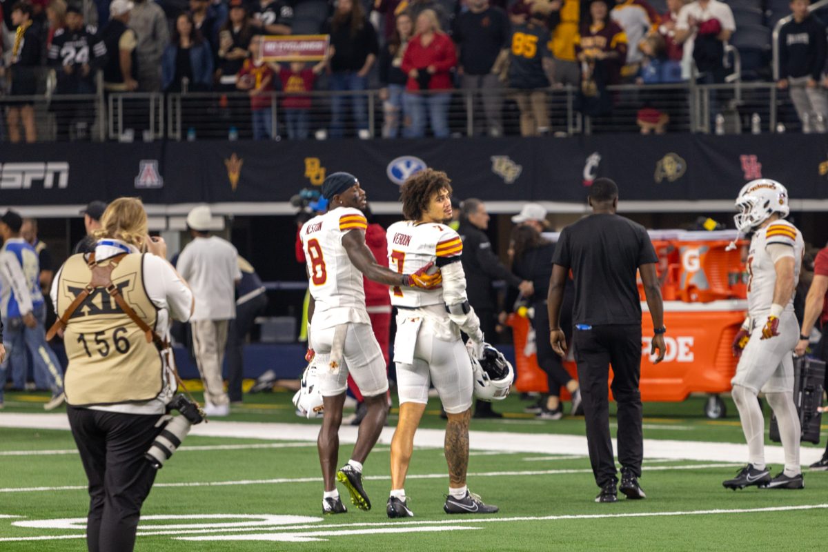 Isaiah Alston (8) comforts Malik Verdon (7) as he looks back at the Arizona State Sun Devils during the championship game at AT&T Stadium in Arlington Texas on December 7th, 2024. 