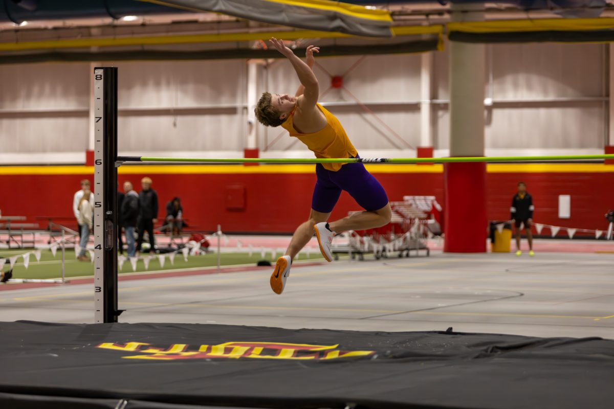 Zack Butcher, a Senior from The University of Northern Iowa, attempts to clear the bar during the Men's Heptathlon High Jump competition at the Iowa State Holiday track invitational, inside Lied Recreation Athletic Center, Ames, Iowa, Dec. 13, 2024. 