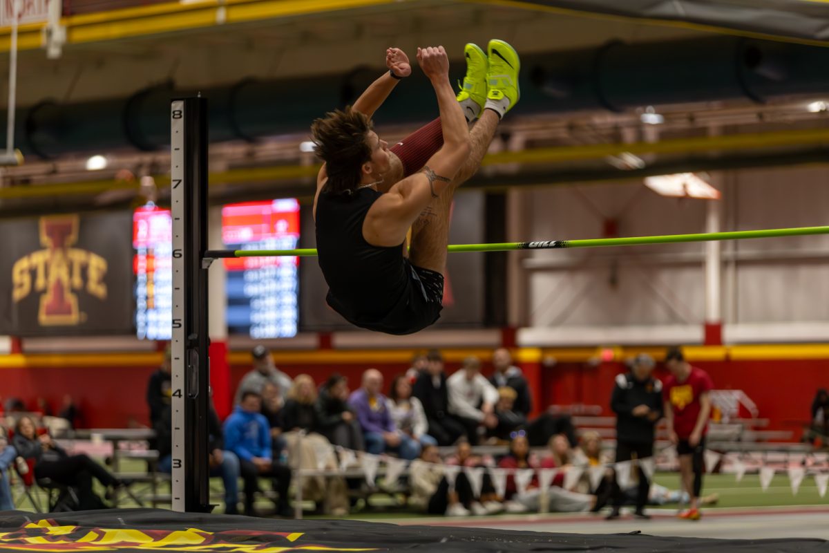 Chase Lathrop, a Freshman from Iowa State, clears the high jump bar during the Men's Heptathlon High Jump competition at the Iowa State Holiday track invitational, inside Lied Recreation Athletic Center, Ames, Iowa, Dec. 13, 2024. 