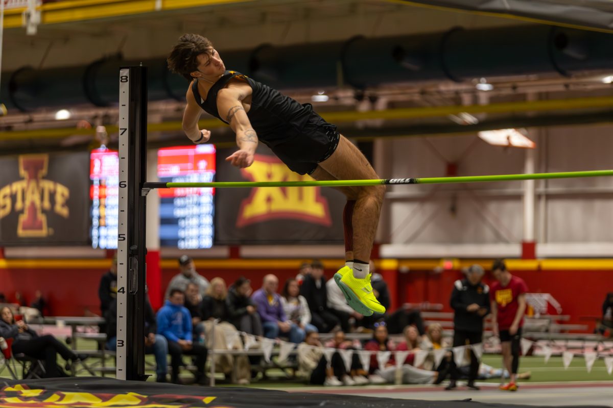 Chase Lathrop, a Freshman from Iowa State, clears the high jump bar during the Men's Heptathlon High Jump competition at the Iowa State Holiday track invitational, inside Lied Recreation Athletic Center, Ames, Iowa, Dec. 13, 2024. 