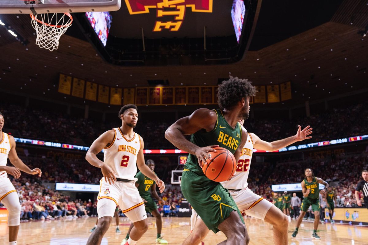 Joshua Jefferson (2) and Milan Momcilovic (22) box in a Baylor player during the Iowa State vs. Baylor University basketball game, Hilton Coliseum, Jan. 4, 2025.