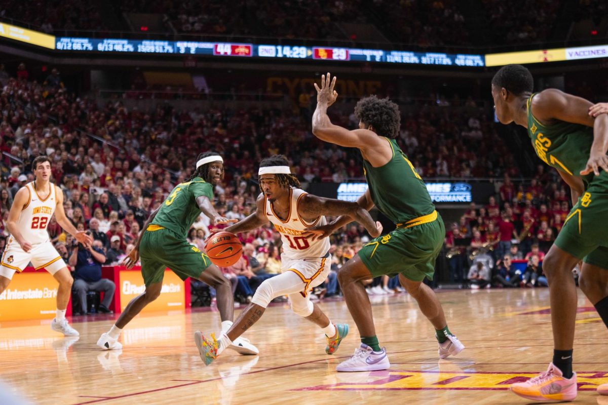 Keshon Gilbert (10) dribbles past defenders to attempt to score during the Iowa State vs. Baylor University basketball game, Hilton Coliseum, Jan. 4, 2025.