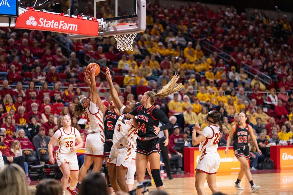 Arianna Jackson (2) attempts to score a rebound over a defender during the Iowa State vs. University of Utah basketball game, Hilton Coliseum, Jan. 5, 2025.