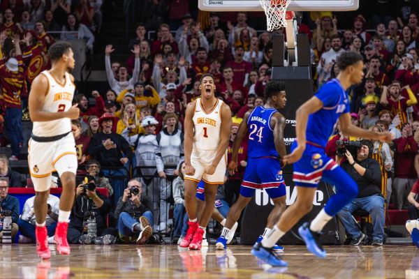 Dishon Jackson (1) celebrates after a dunk during the Iowa State vs. University of Kansas men's basketball game, Hilton Coliseum, Ames, Iowa, Jan. 15, 2025.