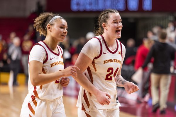 Arianna Jackson (20) and Addy Brown (24) celebrate after beating Texas Tech University 71-58, Hilton Coliseum, Ames, Iowa, Jan. 14, 2025.