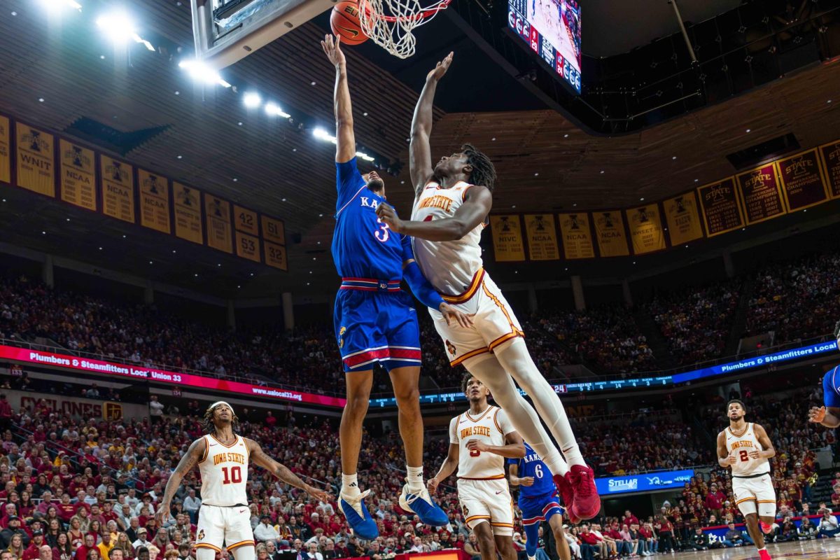 Demarion Watson (4) makes a block during the Iowa State vs. University of Kansas men's basketball game, Hilton Coliseum, Ames, Iowa, Jan. 15, 2025.