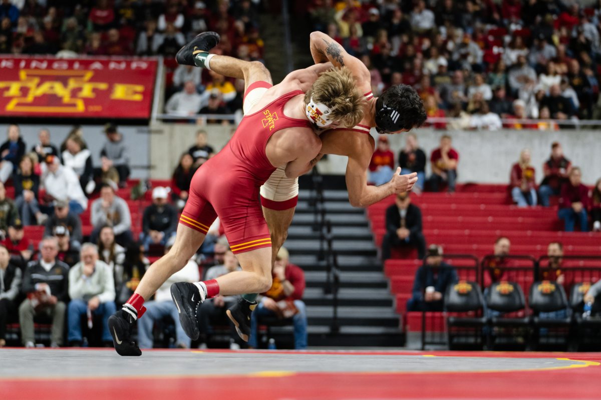 Ethan Perryman (ISU) takes on Antonio Lorenzo (OU) at the Beauty and the Beast event, Jan. 24, 2025, Hilton Coliseum, Ames, Iowa.