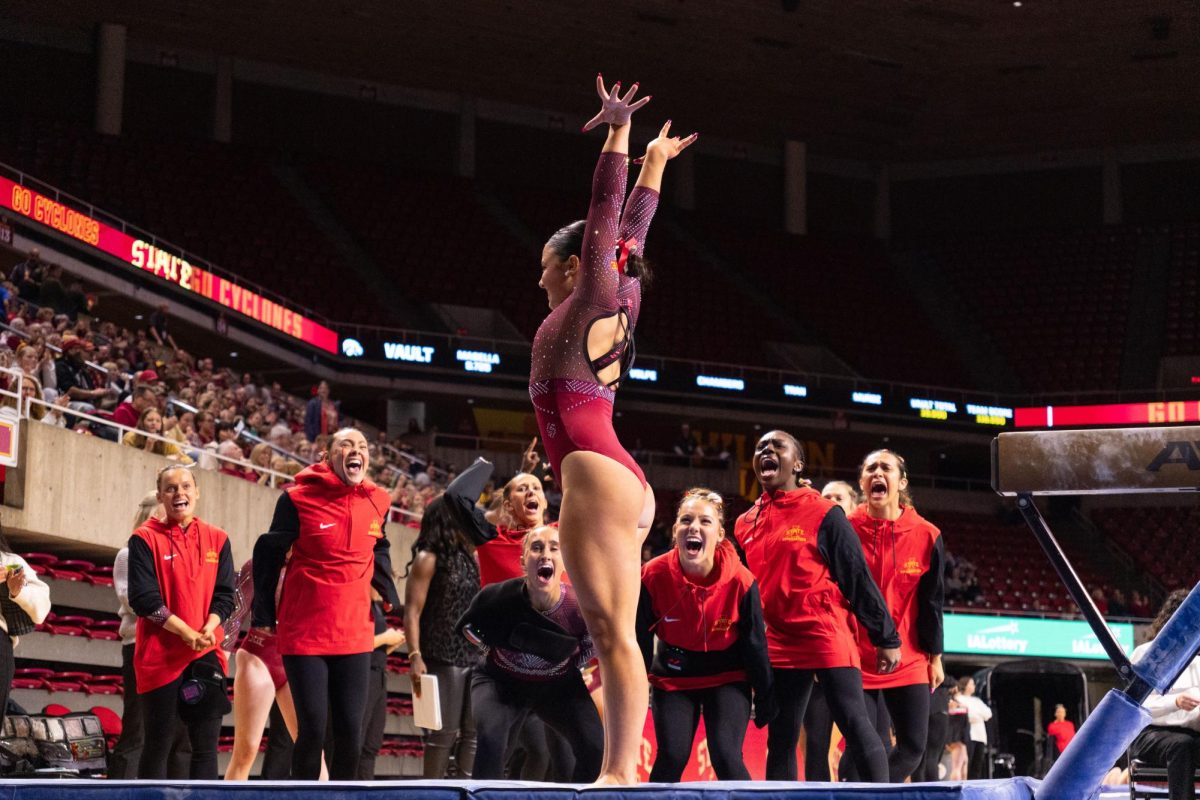 Iowa State celebrates after one of the Gymnasts has a successful dismount off the balance beam during the Iowa State Tri-Meet vs. University of Iowa and Brown University Gymnastics Meet, Hilton Coliseum, Jan. 10, 2025.