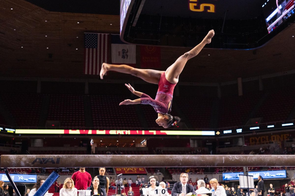 Noelle Adams flips on the balance beam during the Iowa State Tri-Meet vs. University of Iowa and Brown University Gymnastics Meet, Hilton Coliseum, Jan. 10, 2025.