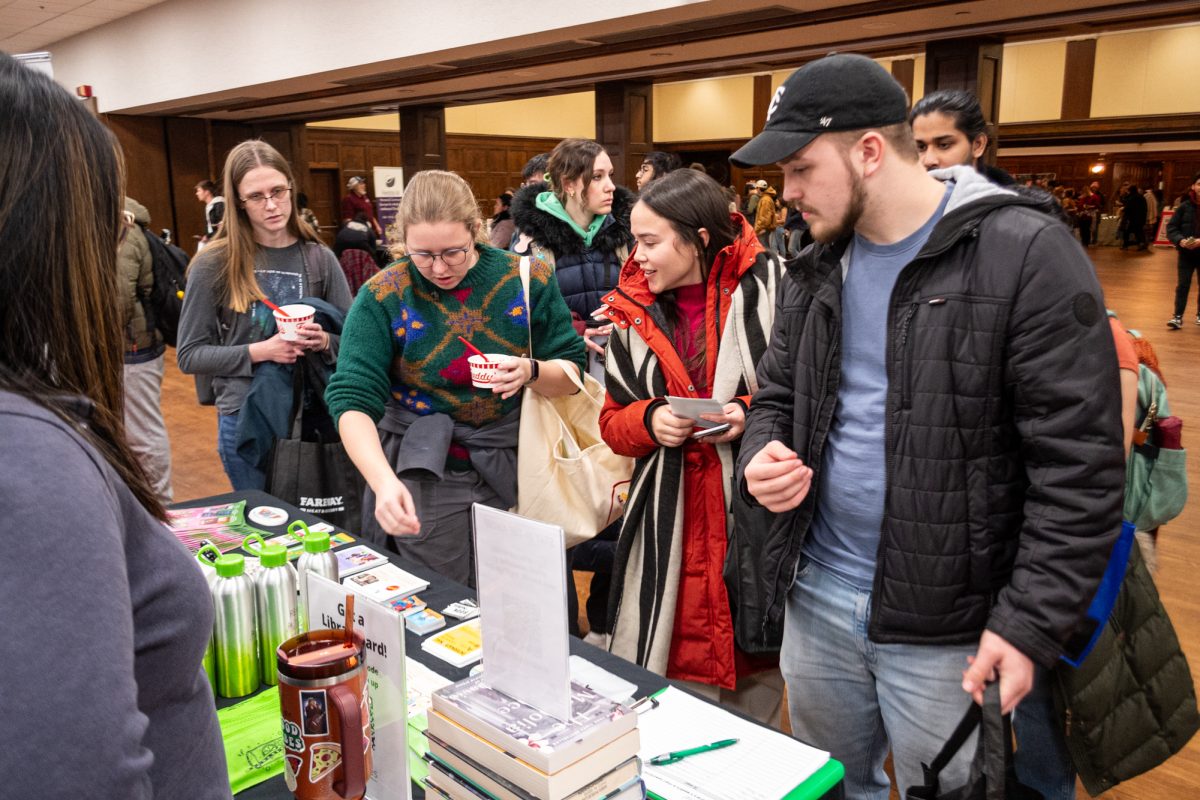 Iowa State University Memorial Union holds the Spring Semester Welcome Fest where Ames Public Library had a booth where students picked up merch and learned about the library, Durham Great Hall, Jan. 23, 2025.